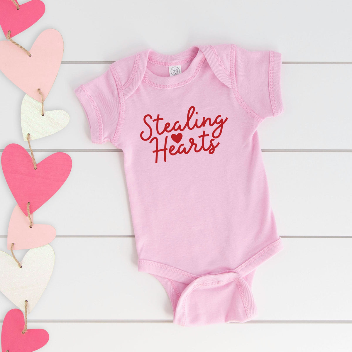 Stealing Hearts Cursive - Baby Short Sleeve Graphic Bodysuit