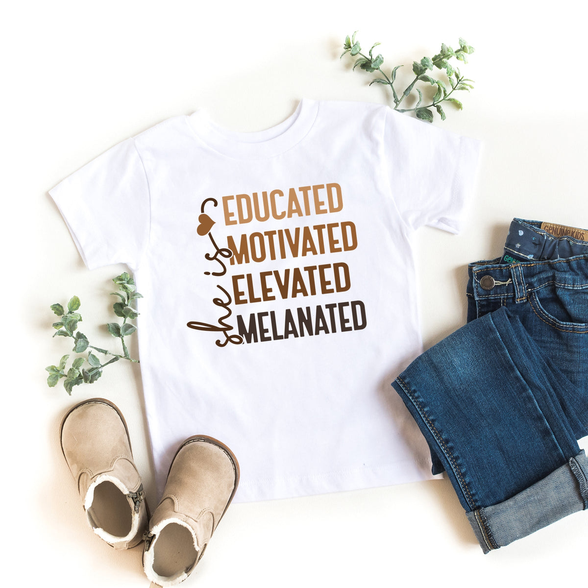 She Is Melanated - Toddler Short Sleeve Graphic T-Shirt